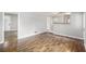 Spacious living room with hardwood flooring, bright lighting, and easy kitchen access at 7248 Banks Mill Rd, Douglasville, GA 30135