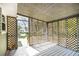 Screened porch with wood lattice work and view to backyard at 7248 Banks Mill Rd, Douglasville, GA 30135