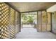 This outdoor porch is screened in with decorative wood panels at 7248 Banks Mill Rd, Douglasville, GA 30135