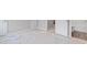 View of a bedroom featuring fresh paint, new carpet, and access to a bathroom at 18 Black Gum Ln # 53, Auburn, GA 30011