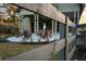 Stylish modern farmhouse-style pool house with an exposed beam and covered patio with outdoor furniture at 18 Black Gum Ln # 53, Auburn, GA 30011