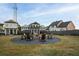 Community fire pit with Adirondack chairs provides a cozy outdoor gathering spot for residents and guests to enjoy evenings together at 18 Black Gum Ln # 53, Auburn, GA 30011