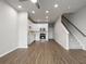 Inviting living area with hard surface flooring, a ceiling fan, and an open-concept kitchen at 18 Black Gum Ln # 53, Auburn, GA 30011