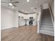 Inviting living area with hard surface flooring, a ceiling fan, and an open-concept kitchen at 18 Black Gum Ln # 53, Auburn, GA 30011