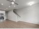 Spacious open-concept area featuring a modern kitchen with white cabinets and hard surface floors at 18 Black Gum Ln # 53, Auburn, GA 30011