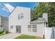 Backyard featuring a concrete patio, well-maintained lawn, and white vinyl privacy fence at 606 Windcroft Nw Cir, Acworth, GA 30101