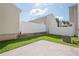 Fenced backyard featuring a concrete patio and a lush green lawn, offering privacy at 606 Windcroft Nw Cir, Acworth, GA 30101