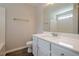 Bathroom featuring a vanity with white cabinets, toilet, shower, and modern fixtures at 606 Windcroft Nw Cir, Acworth, GA 30101