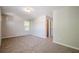 Comfortable bedroom with neutral walls, carpet flooring, and a closet at 606 Windcroft Nw Cir, Acworth, GA 30101