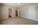 Spacious, bright bedroom with neutral walls, carpet, ensuite bath, and textured ceiling at 606 Windcroft Nw Cir, Acworth, GA 30101