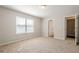 Comfortable bedroom with neutral paint, carpet flooring, closet and ensuite bath at 606 Windcroft Nw Cir, Acworth, GA 30101