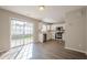 Well-lit kitchen with stainless steel appliances, white cabinets and sliding glass door at 606 Windcroft Nw Cir, Acworth, GA 30101