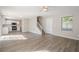 Open concept living area featuring light-colored walls, new flooring and a view to the kitchen at 606 Windcroft Nw Cir, Acworth, GA 30101
