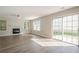Bright living room features a fireplace and sliding glass door for ample natural light at 606 Windcroft Nw Cir, Acworth, GA 30101