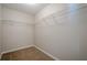Spacious walk-in closet with built-in shelving for optimal storage solutions at 606 Windcroft Nw Cir, Acworth, GA 30101