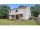 Exterior view of the home with a patio and grassy backyard at 7454 Silver Arrow Se Trl, Austell, GA 30168