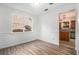 Bright dining area with wood floors and a view of the backyard at 7454 Silver Arrow Se Trl, Austell, GA 30168