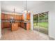 Updated kitchen boasts tile countertops, stainless steel appliances, an island, and sliding glass doors at 7454 Silver Arrow Se Trl, Austell, GA 30168