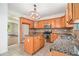 Well-equipped kitchen with stainless steel appliances, granite countertops, and a center island at 7454 Silver Arrow Se Trl, Austell, GA 30168