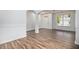 Bright and open living area with hardwood floors, white trim, and natural light at 7454 Silver Arrow Se Trl, Austell, GA 30168