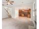 Open-concept living area showcases a cozy fireplace, staircase, and an open view into the kitchen at 7454 Silver Arrow Se Trl, Austell, GA 30168
