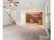 Inviting living room area with a view to the kitchen and hardwood stairs at 7454 Silver Arrow Se Trl, Austell, GA 30168