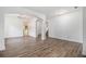 Bright living room with hardwood floors and an open floor plan at 7454 Silver Arrow Se Trl, Austell, GA 30168
