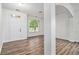 Inviting living area featuring hardwood floors, a large window, and neutral paint at 7454 Silver Arrow Se Trl, Austell, GA 30168