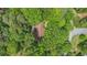 Overhead view of the home's roof surrounded by lush green trees, providing privacy and natural beauty at 12080 Mountain Laurel Dr, Roswell, GA 30075