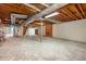 Unfinished basement with exposed ductwork, beams, and potential for customization at 12080 Mountain Laurel Dr, Roswell, GA 30075