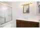 A classic bathroom with a vanity, shower, and tiled walls at 12080 Mountain Laurel Dr, Roswell, GA 30075