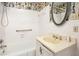 Bathroom with floral wallpaper, a shower, and a single sink vanity at 12080 Mountain Laurel Dr, Roswell, GA 30075