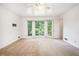 Spacious bedroom featuring a ceiling fan, large windows, and neutral walls at 12080 Mountain Laurel Dr, Roswell, GA 30075