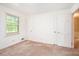 A light and airy bedroom featuring neutral walls, carpet flooring and large window views at 12080 Mountain Laurel Dr, Roswell, GA 30075