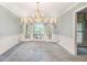 Traditional dining room with chandelier, large windows and bay window at 12080 Mountain Laurel Dr, Roswell, GA 30075