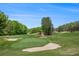 Expansive golf course view showcasing lush green fairways, sand traps, and mature trees, perfect for golf enthusiasts at 12080 Mountain Laurel Dr, Roswell, GA 30075