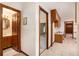 Hallway with bathroom access and view of room with desk at 12080 Mountain Laurel Dr, Roswell, GA 30075