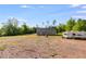 Spacious backyard with a mobile home and swing set at 130 Williams Rd, Villa Rica, GA 30180