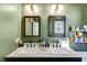 Bathroom vanity with dual sinks and framed mirrors at 130 Williams Rd, Villa Rica, GA 30180