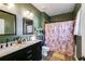 Well-lit bathroom featuring a dual sink vanity at 130 Williams Rd, Villa Rica, GA 30180