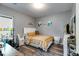 Bedroom with a bed, ceiling fan, shelving, desk, laundry basket and decor at 130 Williams Rd, Villa Rica, GA 30180