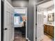 Hallway view into the primary bedroom on the left and bathroom on the right at 130 Williams Rd, Villa Rica, GA 30180