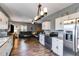 Open living room and kitchen with stainless steel appliances and hardwood floors at 130 Williams Rd, Villa Rica, GA 30180