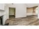 Open-concept living area with new wood floors and views of dining and kitchen spaces at 155 Oak Terrace Dr, Covington, GA 30016