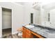 Bathroom features an extended vanity, a large mirror, a toilet and a shower at 155 Oak Terrace Dr, Covington, GA 30016