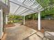 Relax under a pergola in this serene backyard setting at 2012 Elm Grove Ln, Hampton, GA 30228