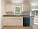 This charming kitchen features ample cabinet space and a view of the backyard at 2012 Elm Grove Ln, Hampton, GA 30228