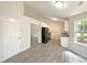 Well-lit eat-in kitchen has stainless steel appliances and new flooring at 2012 Elm Grove Ln, Hampton, GA 30228