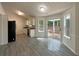 Bright kitchen features new cabinets, stainless steel appliances, and sliding doors to the backyard at 2012 Elm Grove Ln, Hampton, GA 30228