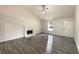 Spacious living room featuring a fireplace and abundant natural light at 2012 Elm Grove Ln, Hampton, GA 30228